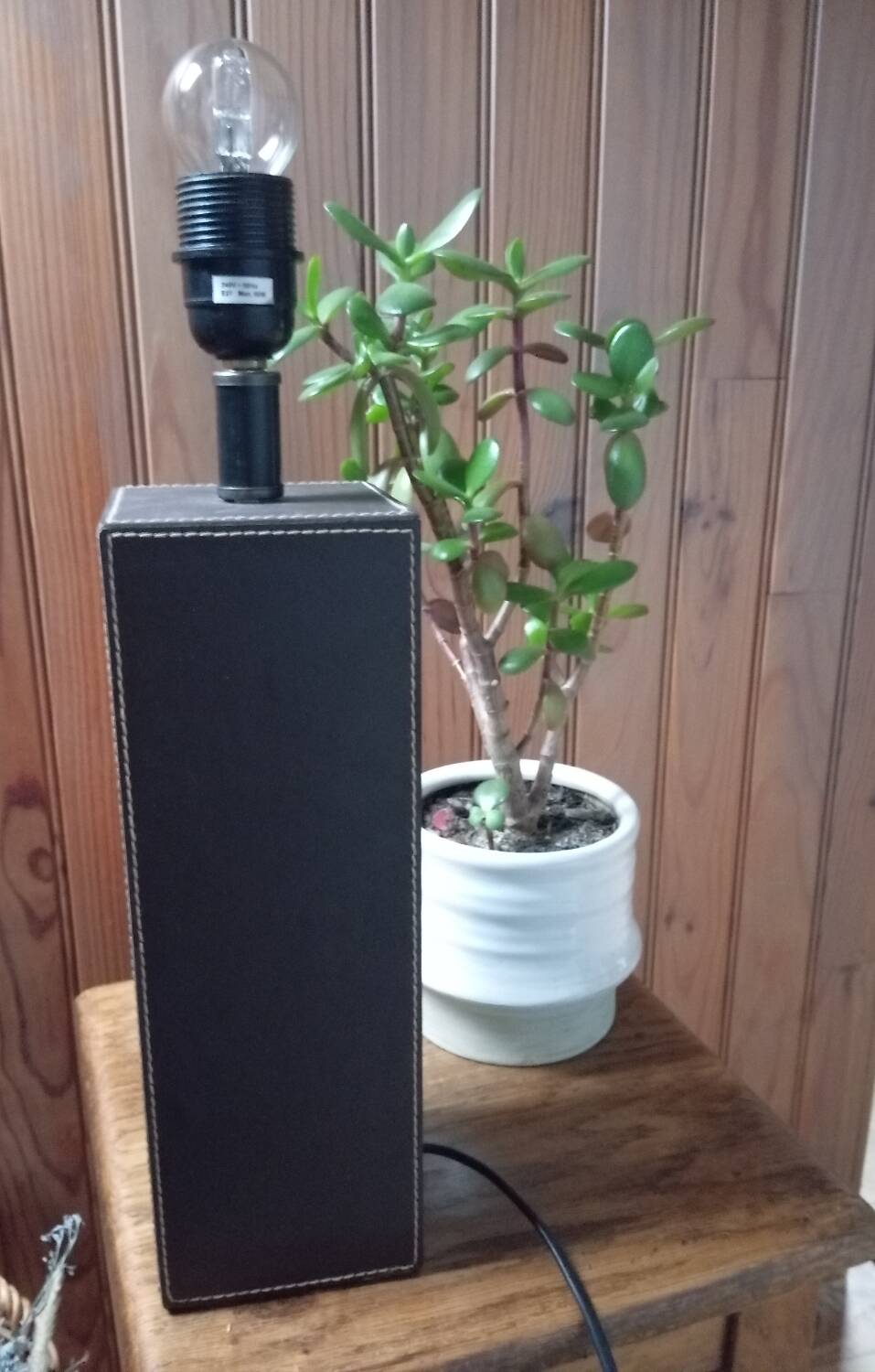 Tall cubic brown leather lamp, light gray fabric lampshade