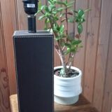 Tall cubic brown leather lamp, light gray fabric lampshade