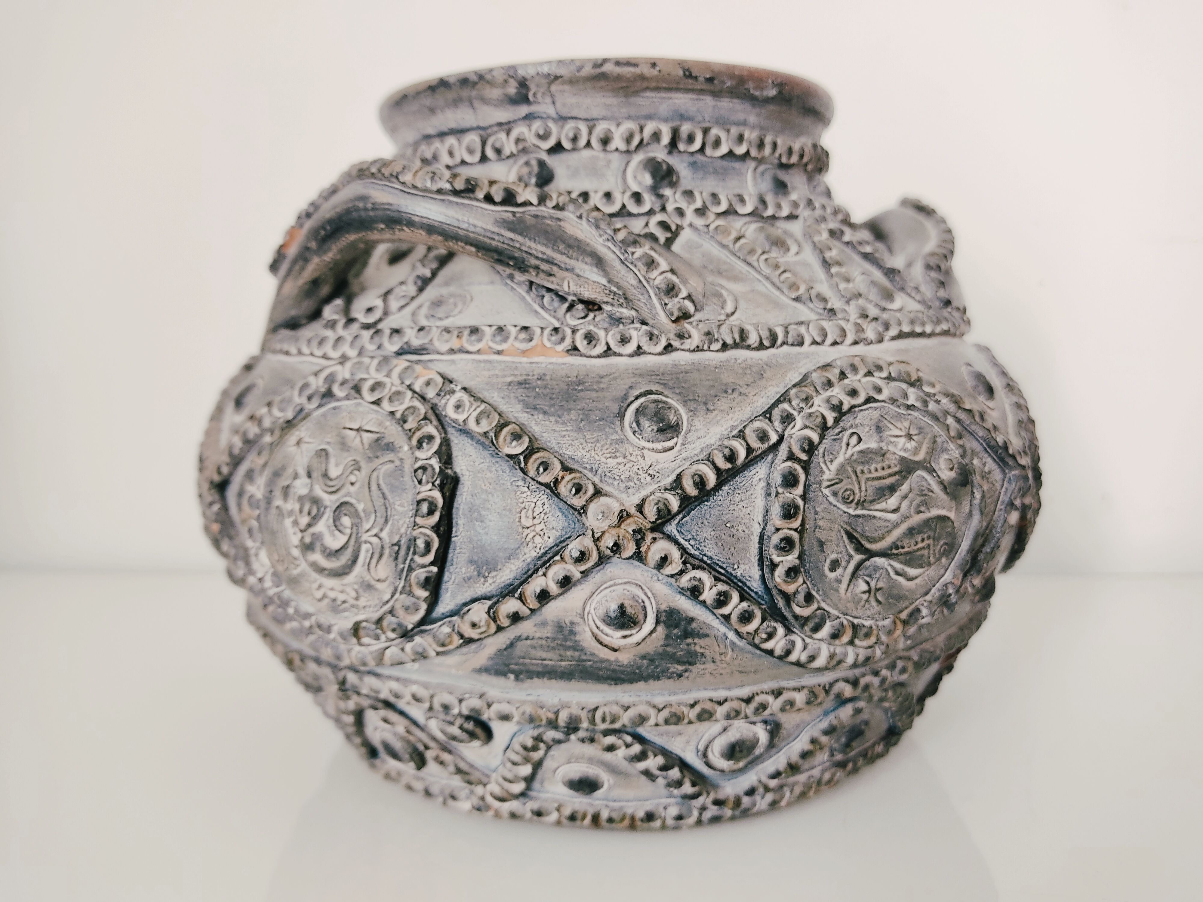 Terracotta vase with decoration astrological signs