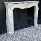 Louis XV style fireplace in white Carrara marble arabescato