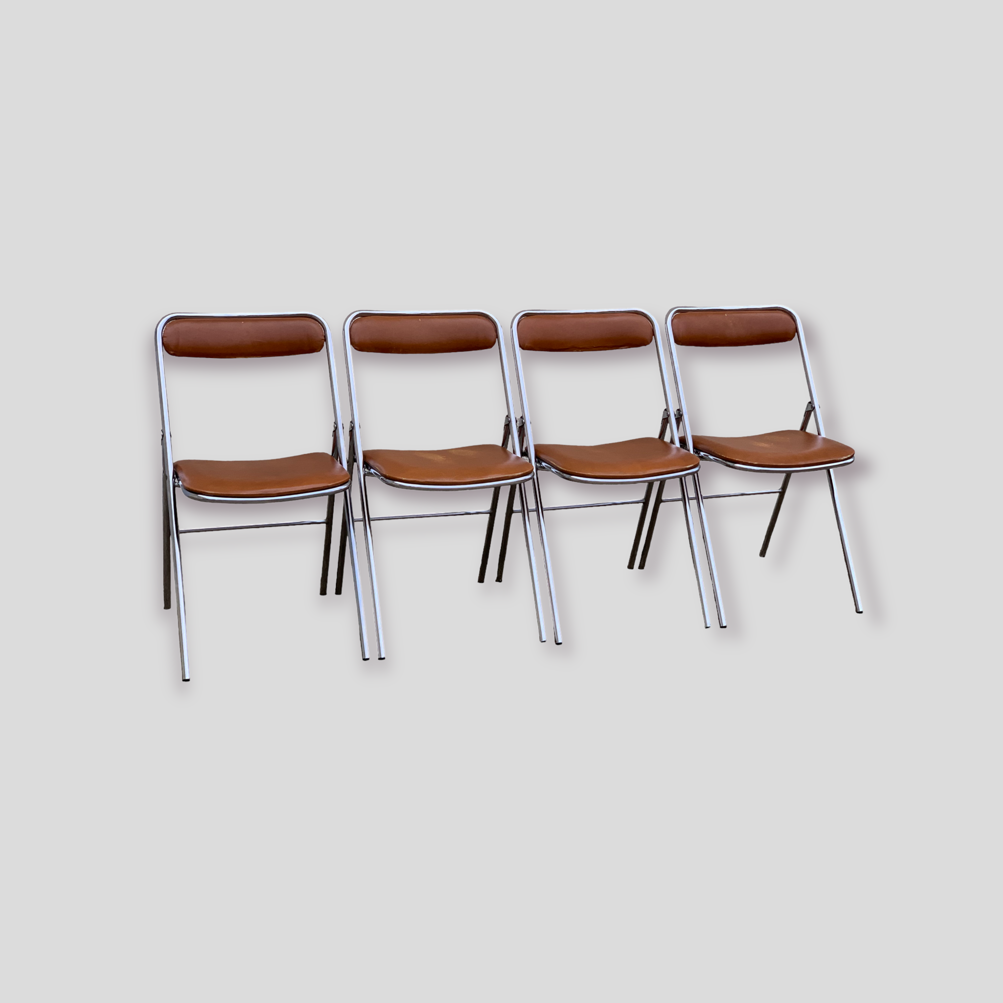 4 folding chairs chromed metal and Skaï fawn 1970