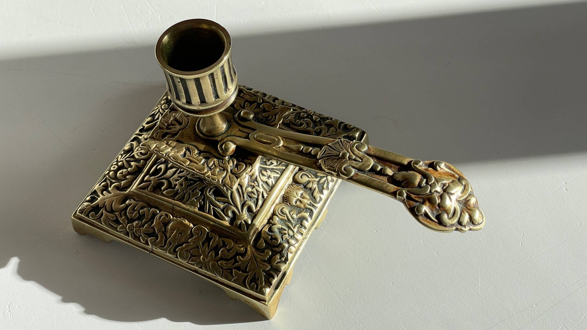 Patterned solid bronze hand candle holder