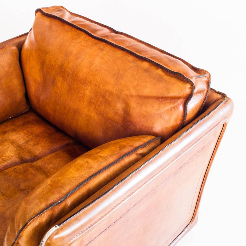 Vintage club armchair by Roche Bobois. Camel buffalo leather. France, 1980s.