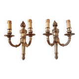 Pair of Louis XV style rocaille two-armed sconces in gilded bronze