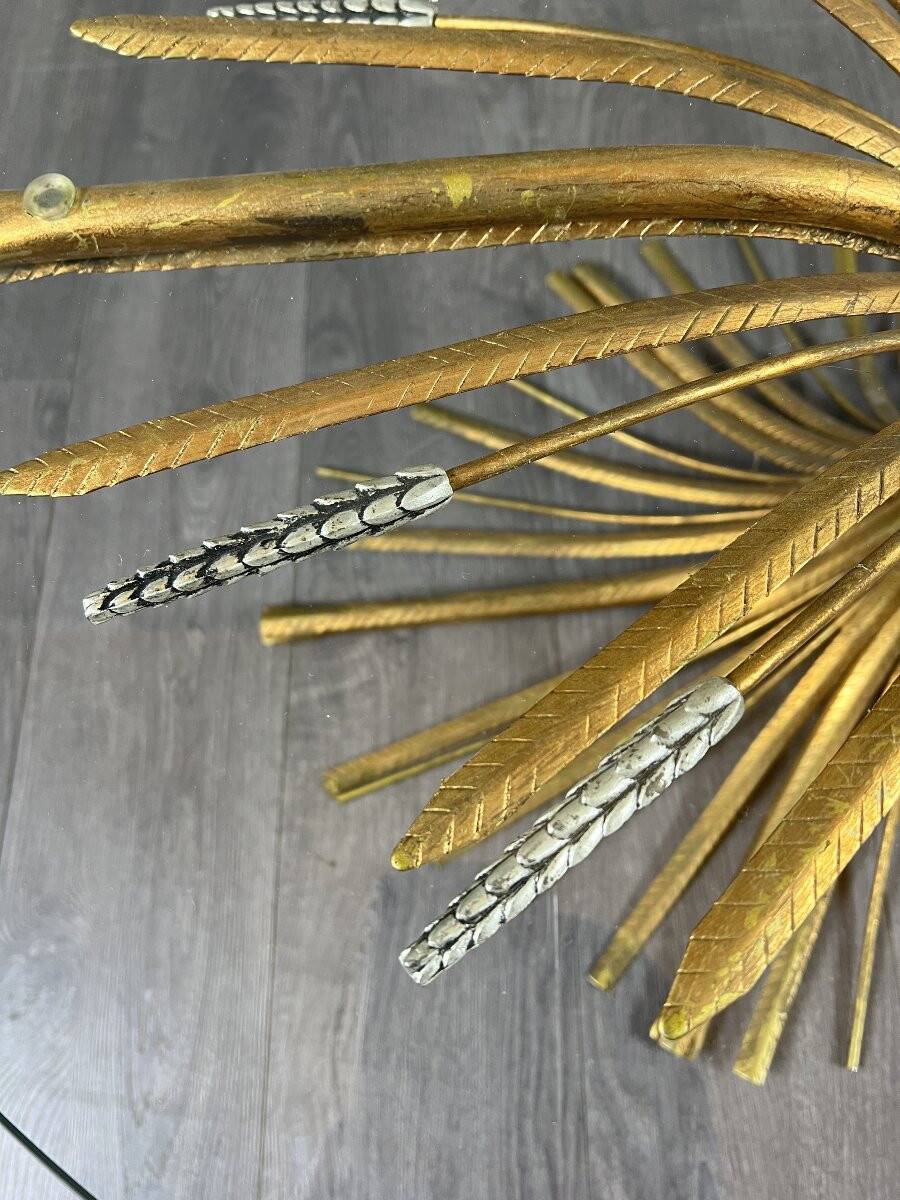 Gold metal and glass coffee table, 20th century, in the style of Robert Goos.