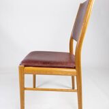Suite of six chairs in oak and leather