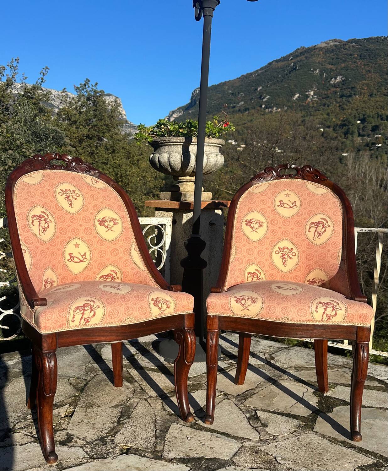 Pair of carved solid mahogany gondolas from the 19th century