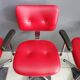Quatre chaises de barbier en cuir rouge des années 1960 avec accoudoirs bakelite