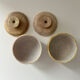 2 small stone urns