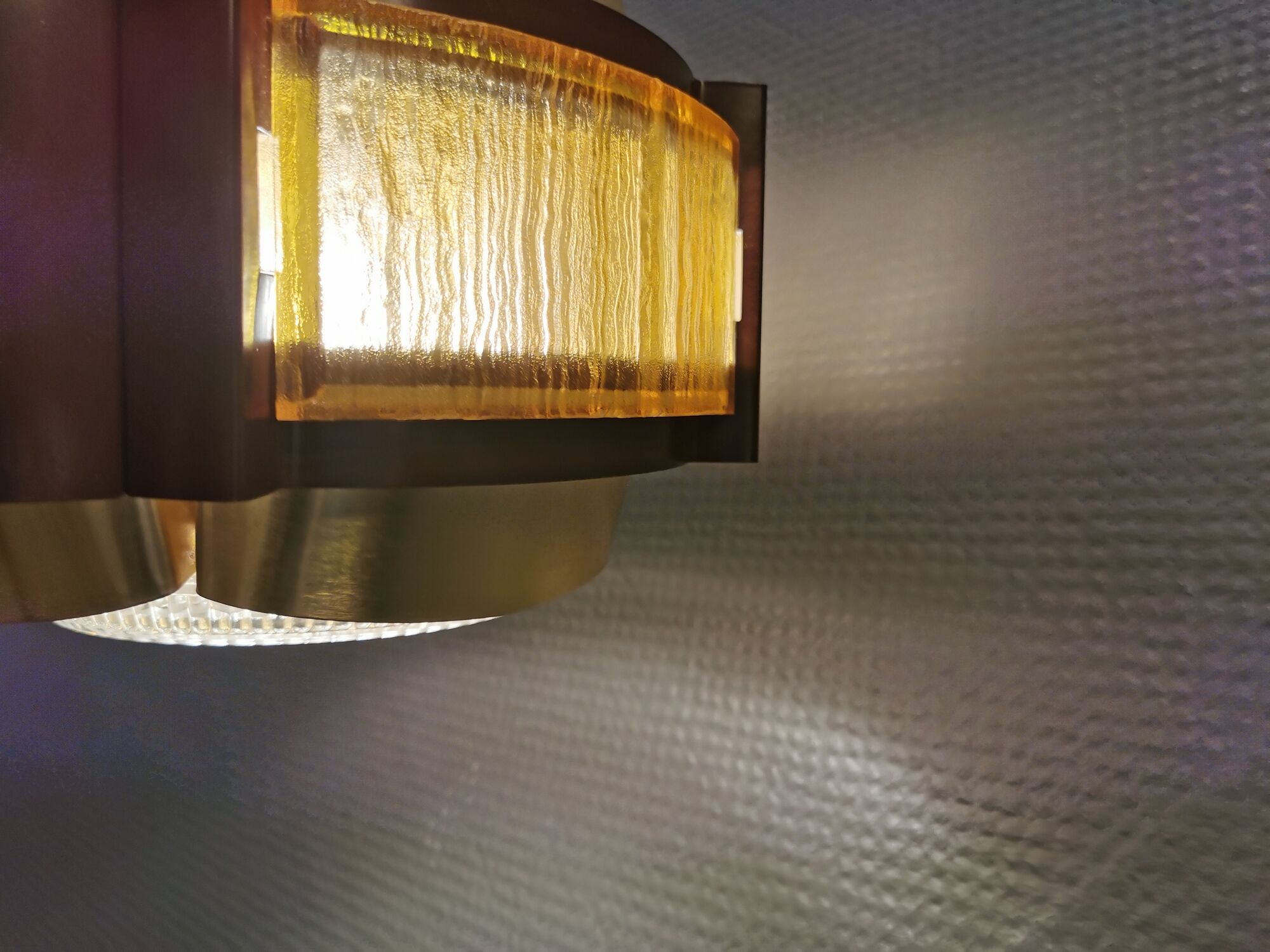 Danish hanging lamp, made in brass colored and brown metal, with yellowish hard pressed plastic deta