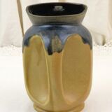 Vintage art deco water pitcher with drippy dark blue glaze.