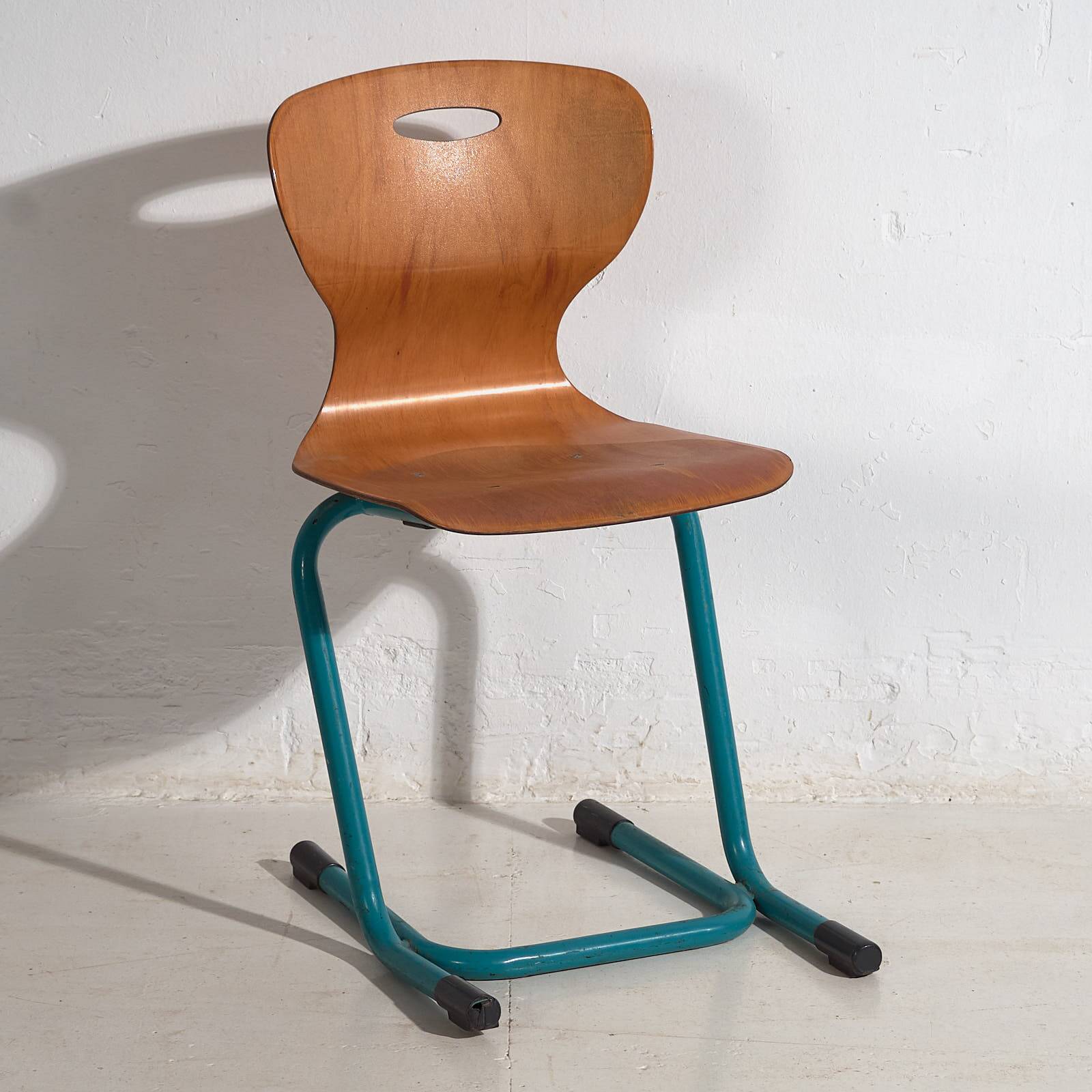 Vintage turquoise blue school chairs (c.1950). Set of 4 pieces