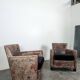 Pair of Roche Bobois armchairs with floral patterns.