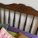 1 bed with a wooden frame and mattress