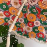 Large floral tilting beach umbrella with cotton fringes, 1960