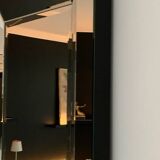 Asymmetrical beveled mirror