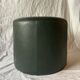 Pouf vintage rond en Skaï vert