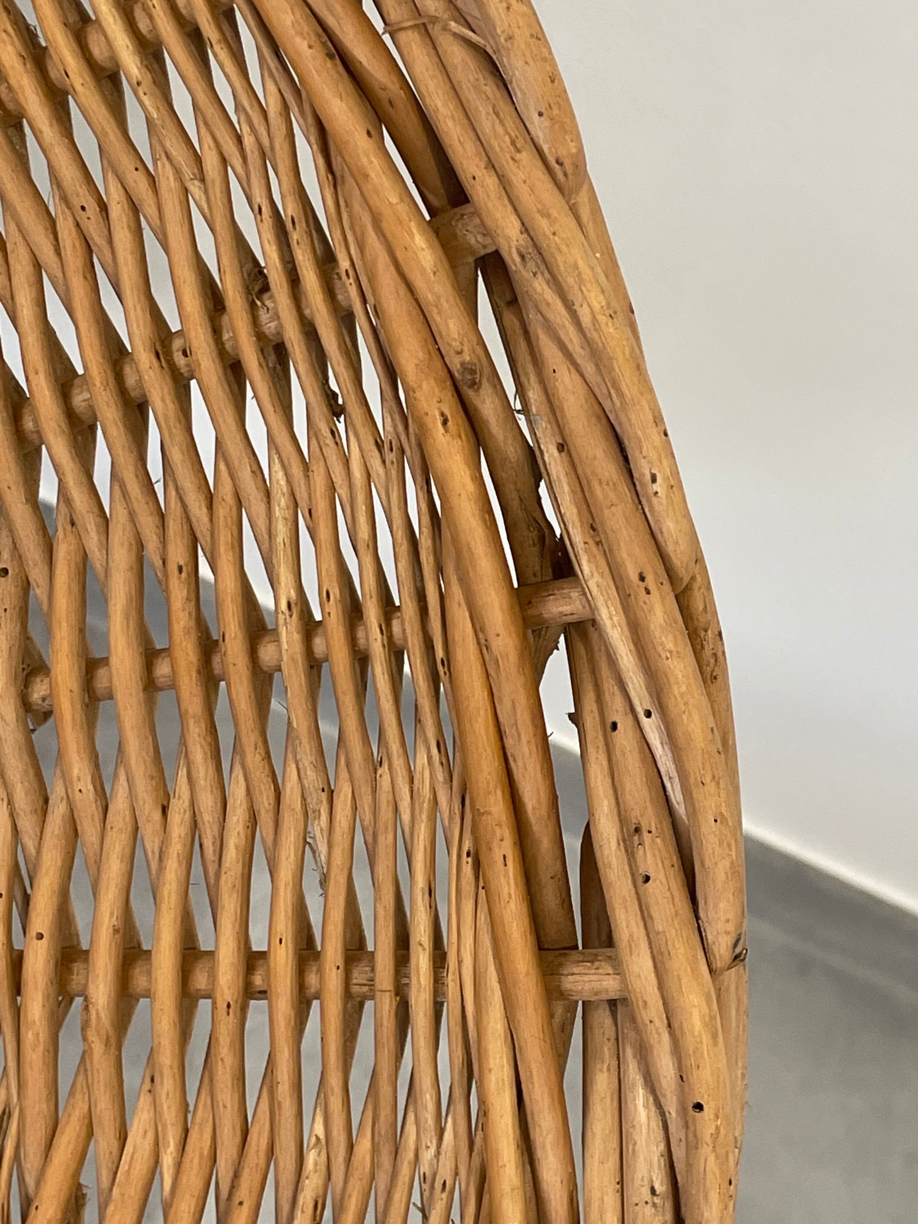 Pair of rattan and black metal armchairs, 1950s/60s