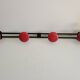 Wall-mounted coat rack in black and red metal (4 hooks)
