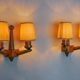 Pair of two-armed art deco "ball" wall lights, carved wood, France, 1960