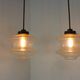 Set of two glass pendant lighting designed by Raak Holland