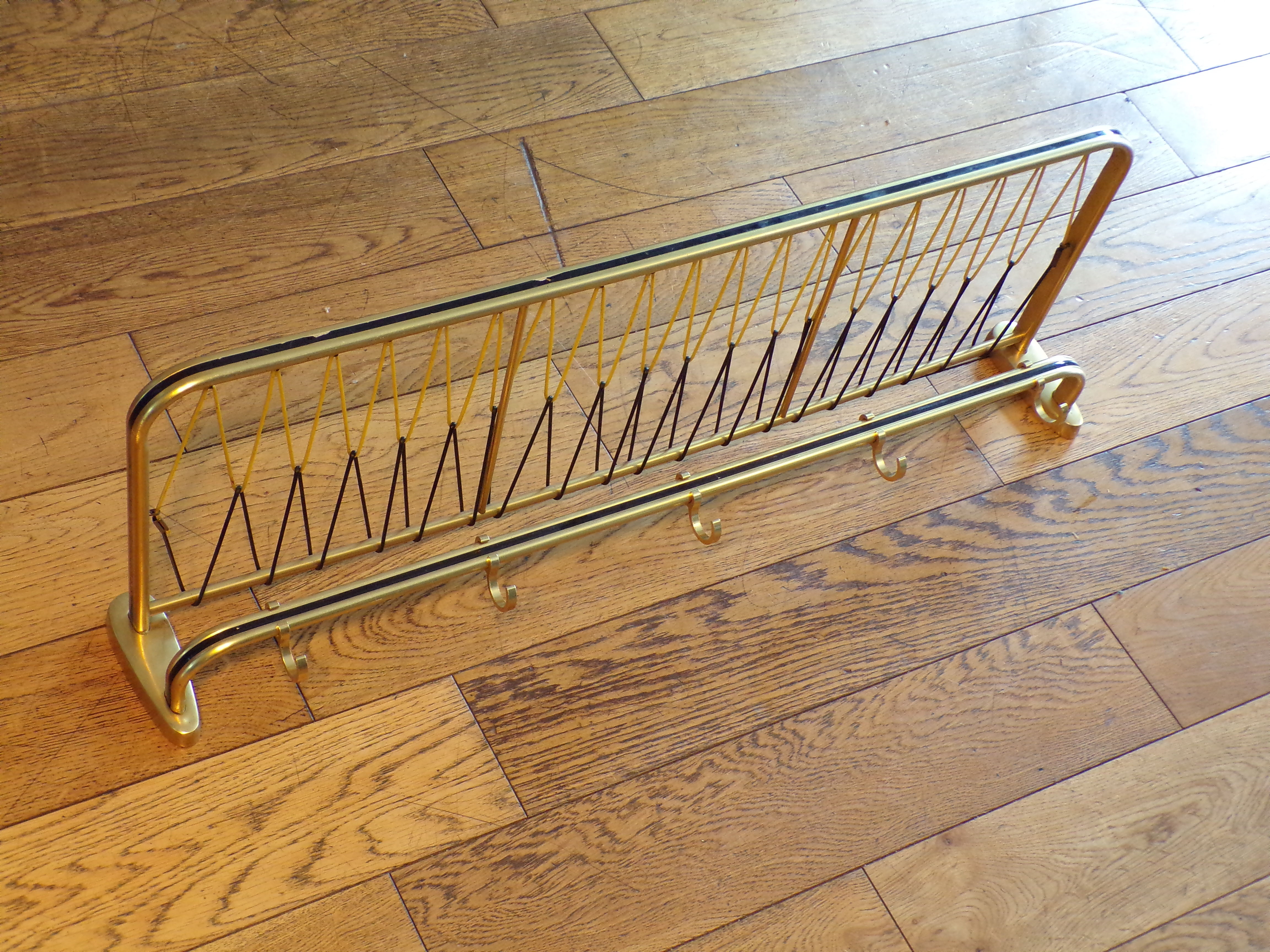 Vintage coat racks like train luggage racks