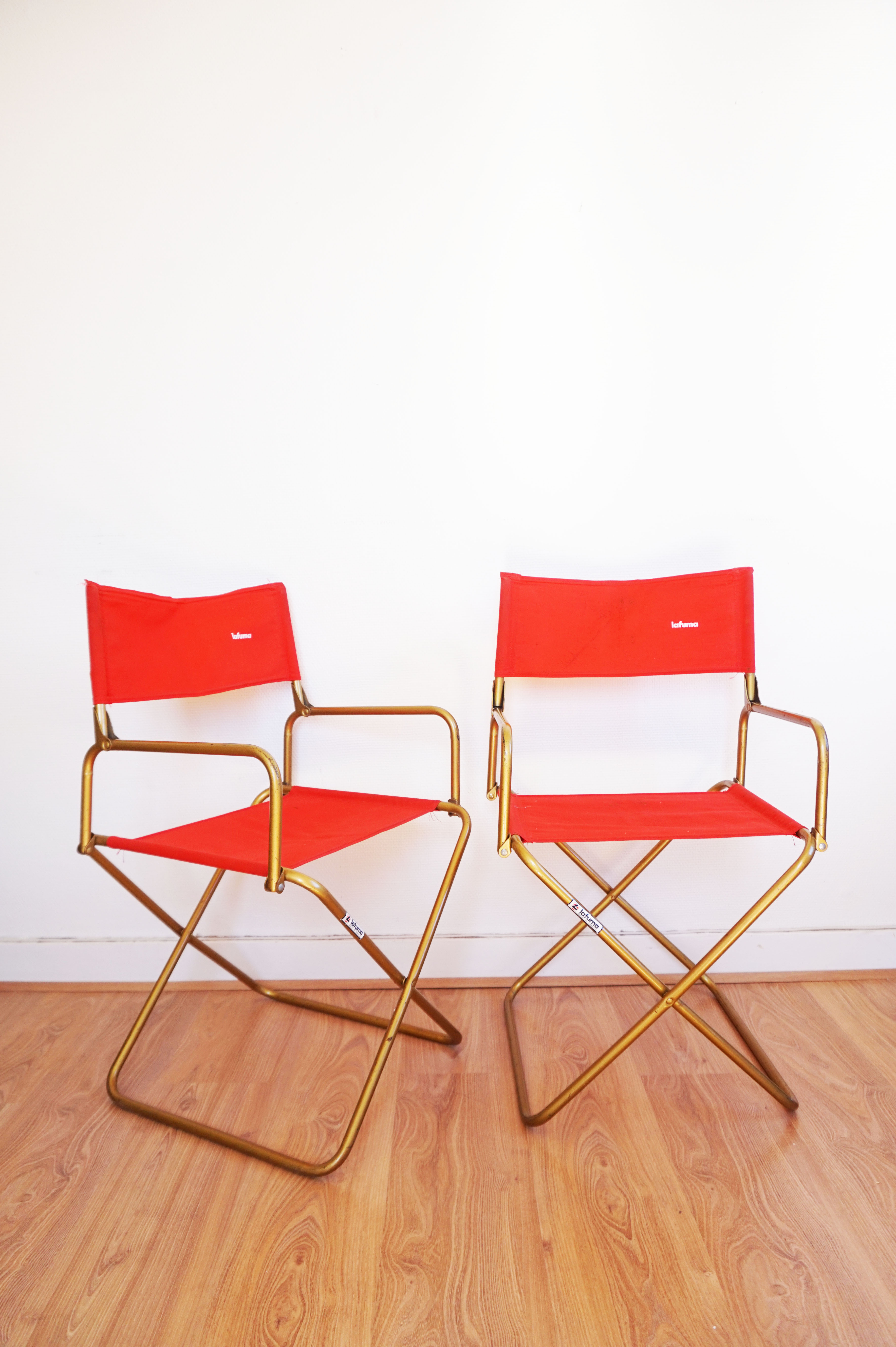 Red vintage pair of lafuma folding chairs