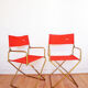 Red vintage pair of lafuma folding chairs
