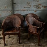 Arm chairs in dark rattan