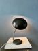 Small black metal desk lamp in Bauhaus style.