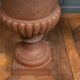 Pair of cast iron garden vases of Medici shape foot shower early twentieth century