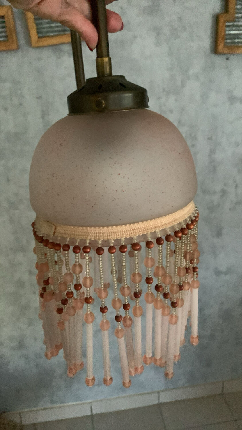 Pair of wall sconces in pink glass and pendants.