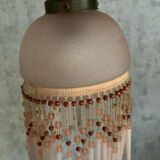 Pair of wall sconces in pink glass and pendants.