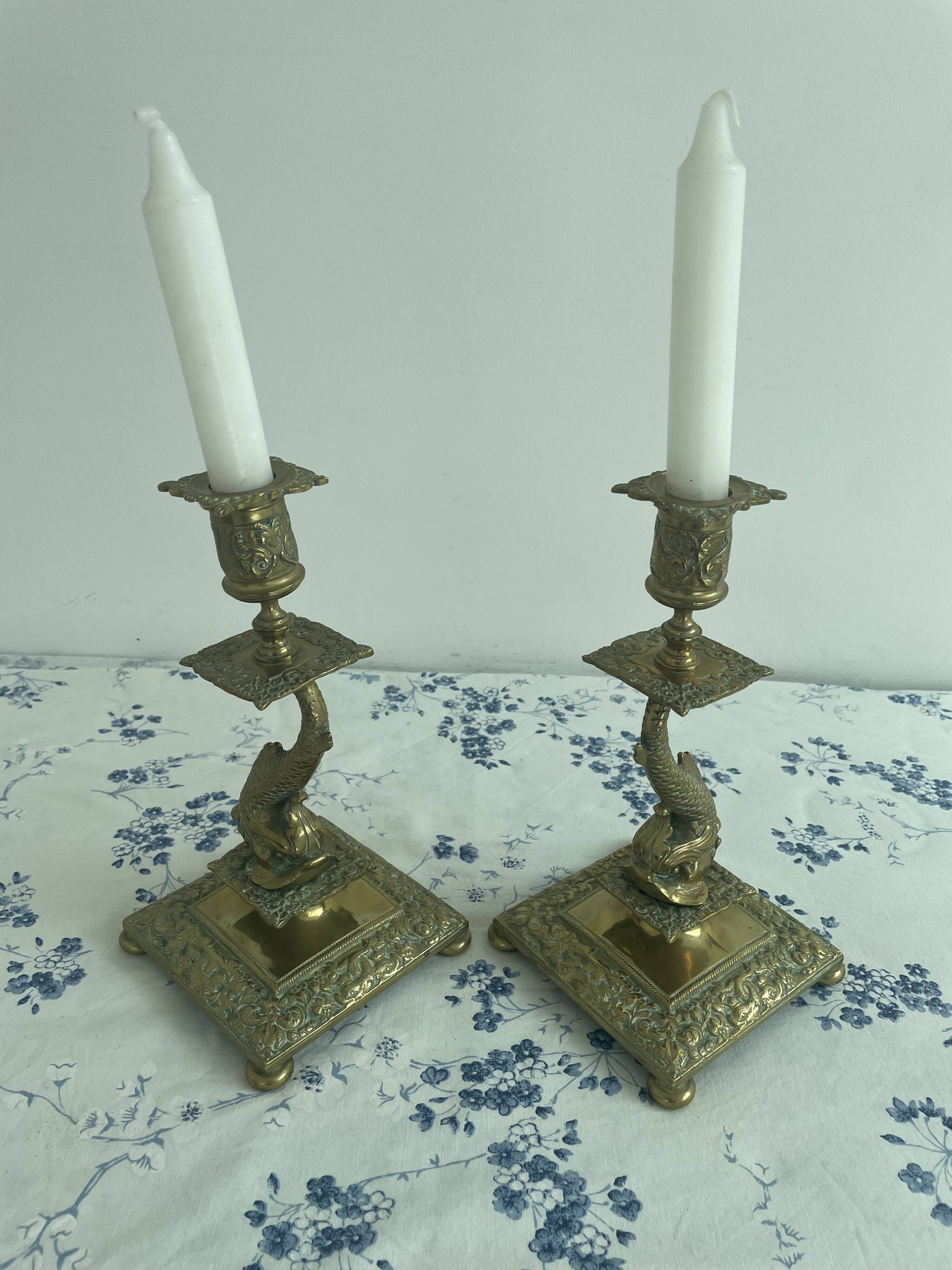 Pair of brass dolphin candlesticks, late 19th century, Napoleonic period