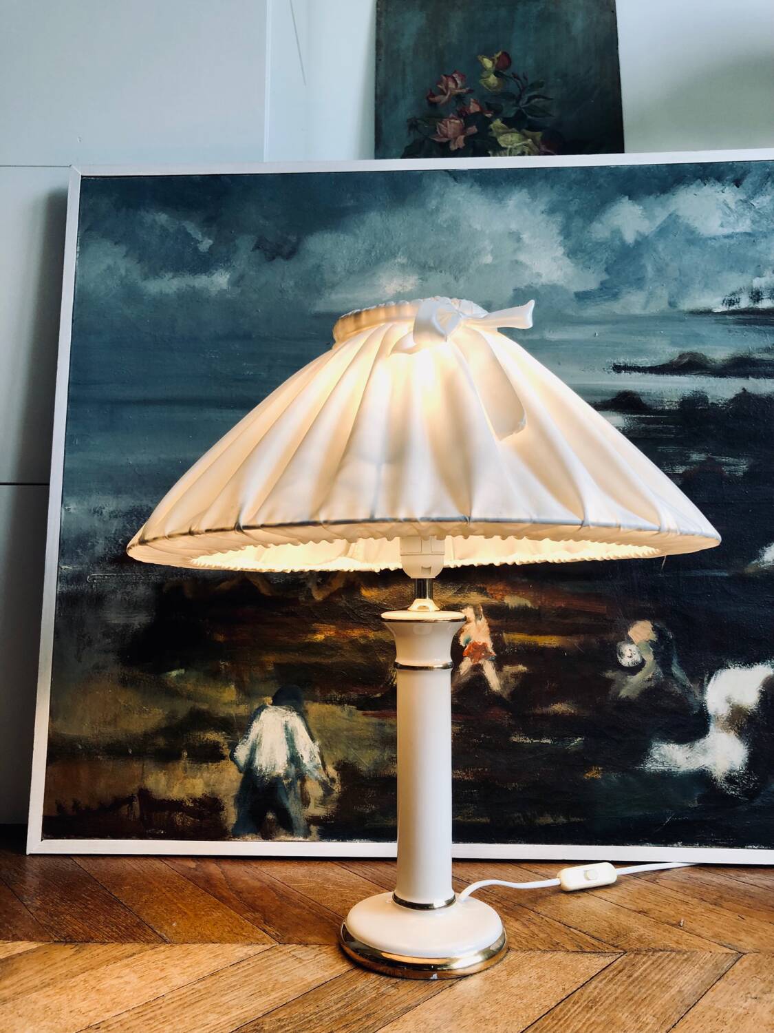 Vintage ivory ceramic lamp with gilding.
