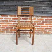 Old wooden chair in the style of Pierre Cruège.