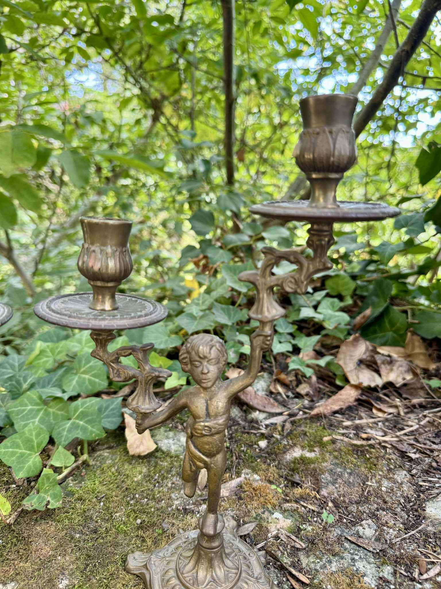 Pair of brass cherub candlesticks