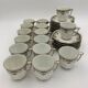 Large porcelain coffee service, 33 pieces, signed RAYNAUD - Cie Limoges - 1940s