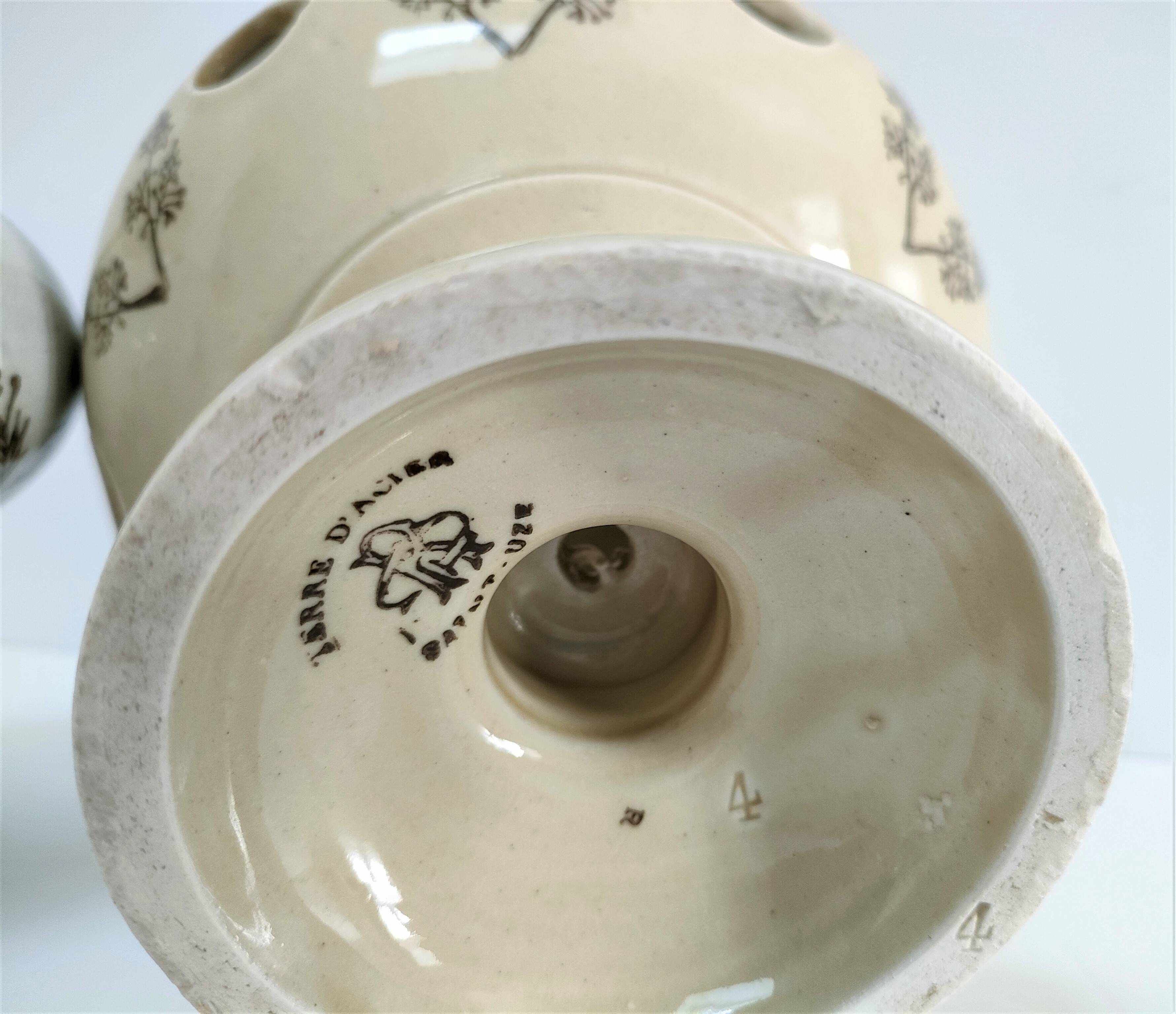 Three Saint-Uze ceramic tealight candle holders, early 20th century