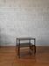 Side table with drop-leaf shelves from the 1970s.