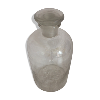 Former tranparent bottle with its stopper glass