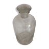 Former tranparent bottle with its stopper glass