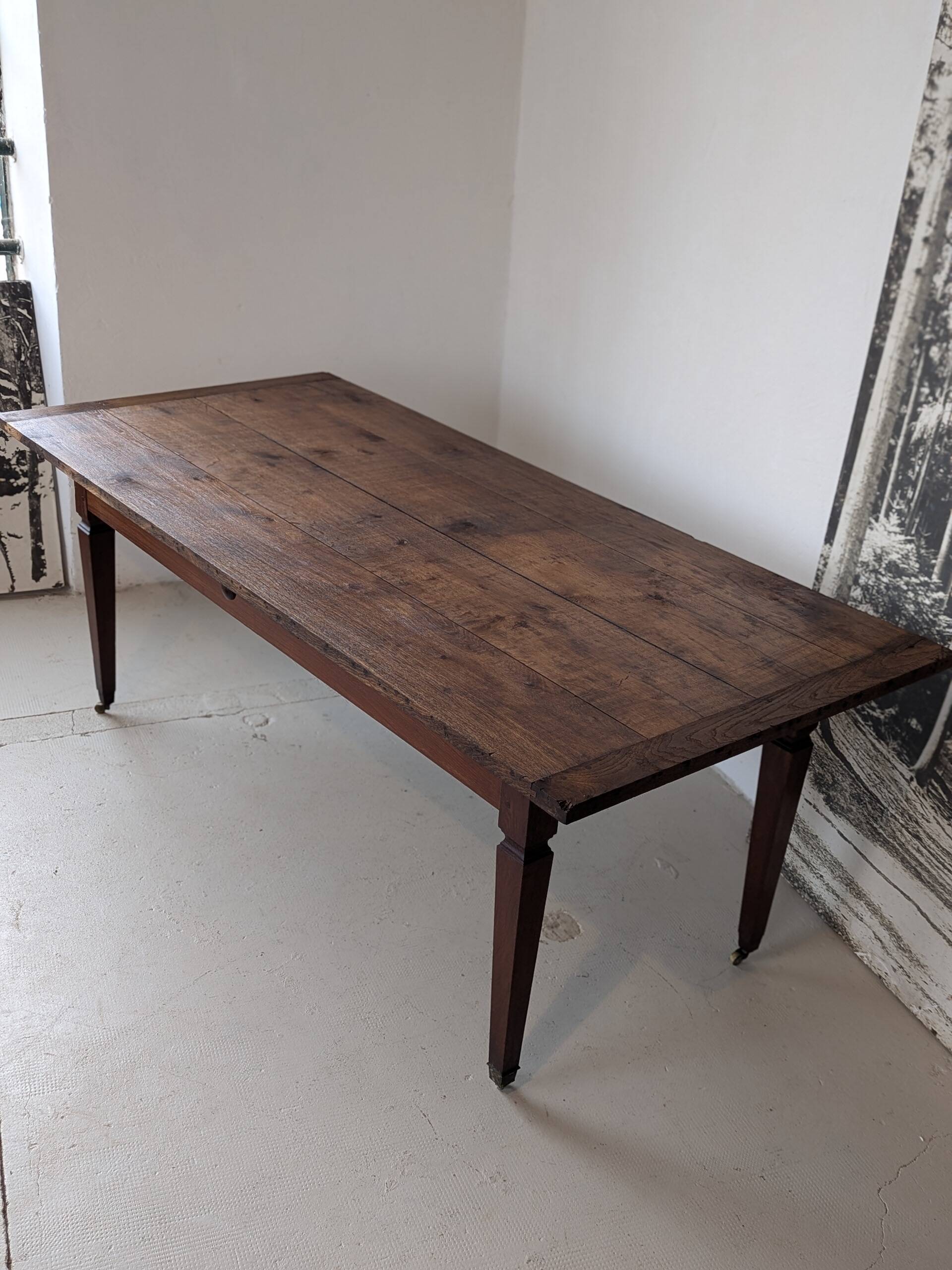 Campaign table in solid oak, Directoire style.