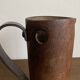 Mountain pitcher in monoxile wood and leather folk art