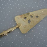 Golden metal pie shovel