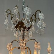 Bronze cage chandelier adorned with molded glass pendants in the shape of peacock feathers, circa 1800