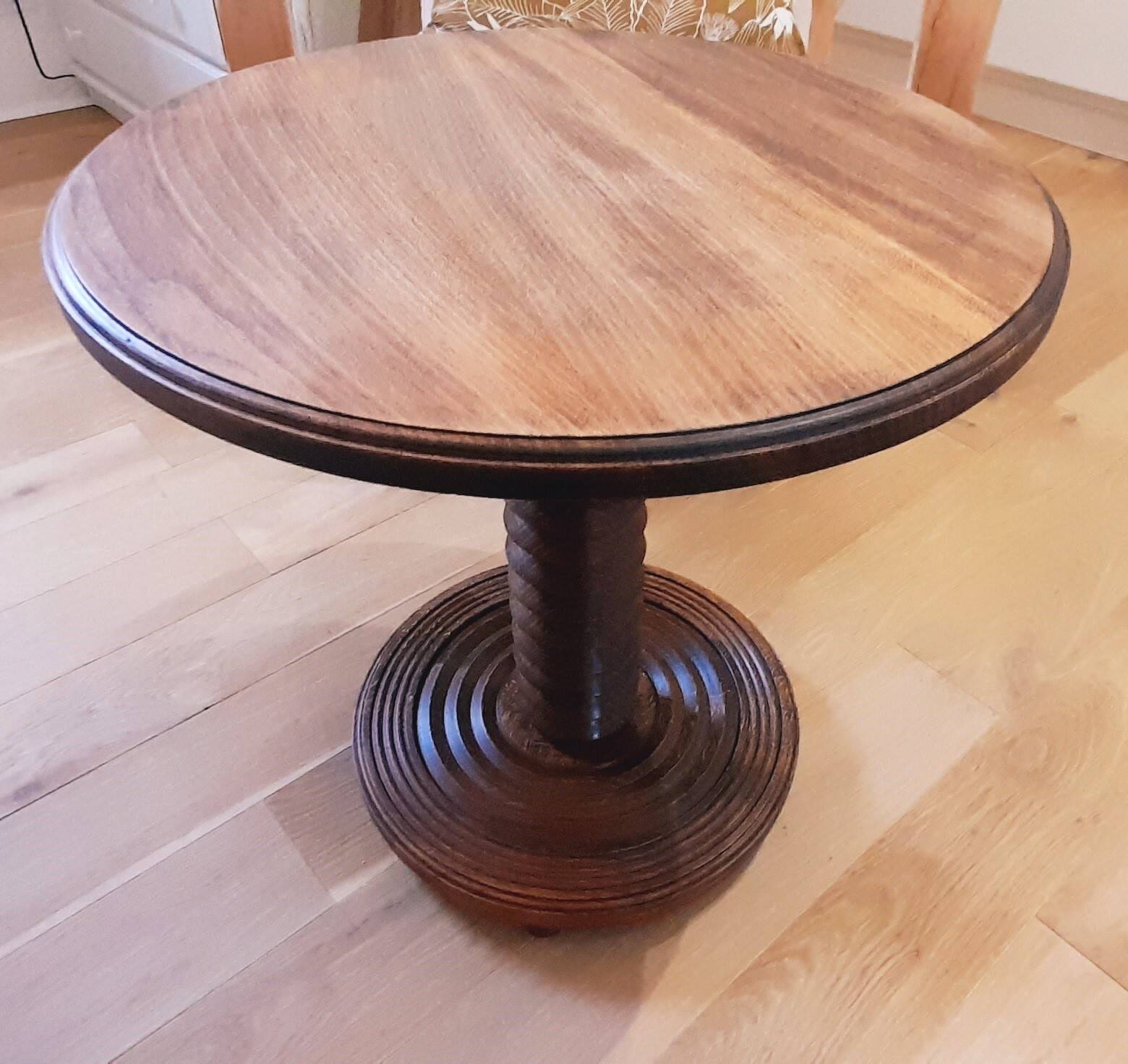 Brutalist side table with turned wood and wine press leg.