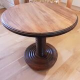 Brutalist side table with turned wood and wine press leg.