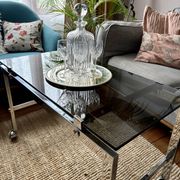 Chrome and smoked glass coffee table on wheels 1970