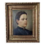 Oil on canvas portrait in an antique gilded wooden frame.